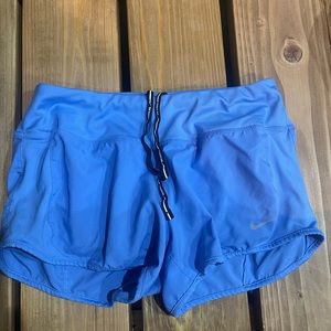 Blue Nike Shorts with built in underwear.
